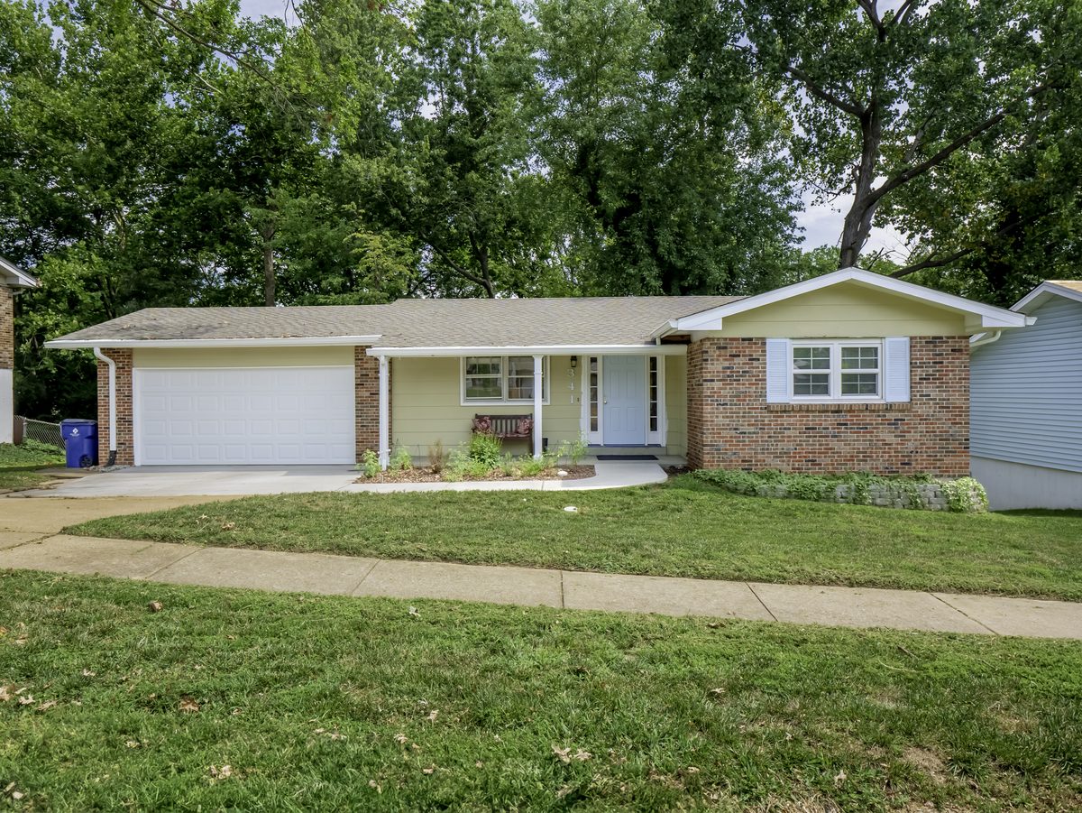 Updated brick and vinyl ranch with a two-car garage on a large lot in South County St. Louis
