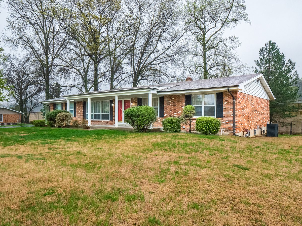 South County St. Louis homes for sale — full brick ranch with covered porch on large lot on Roanna Drive, representative of the post-war housing stock buyers find in Mehlville, Affton, and Lemay