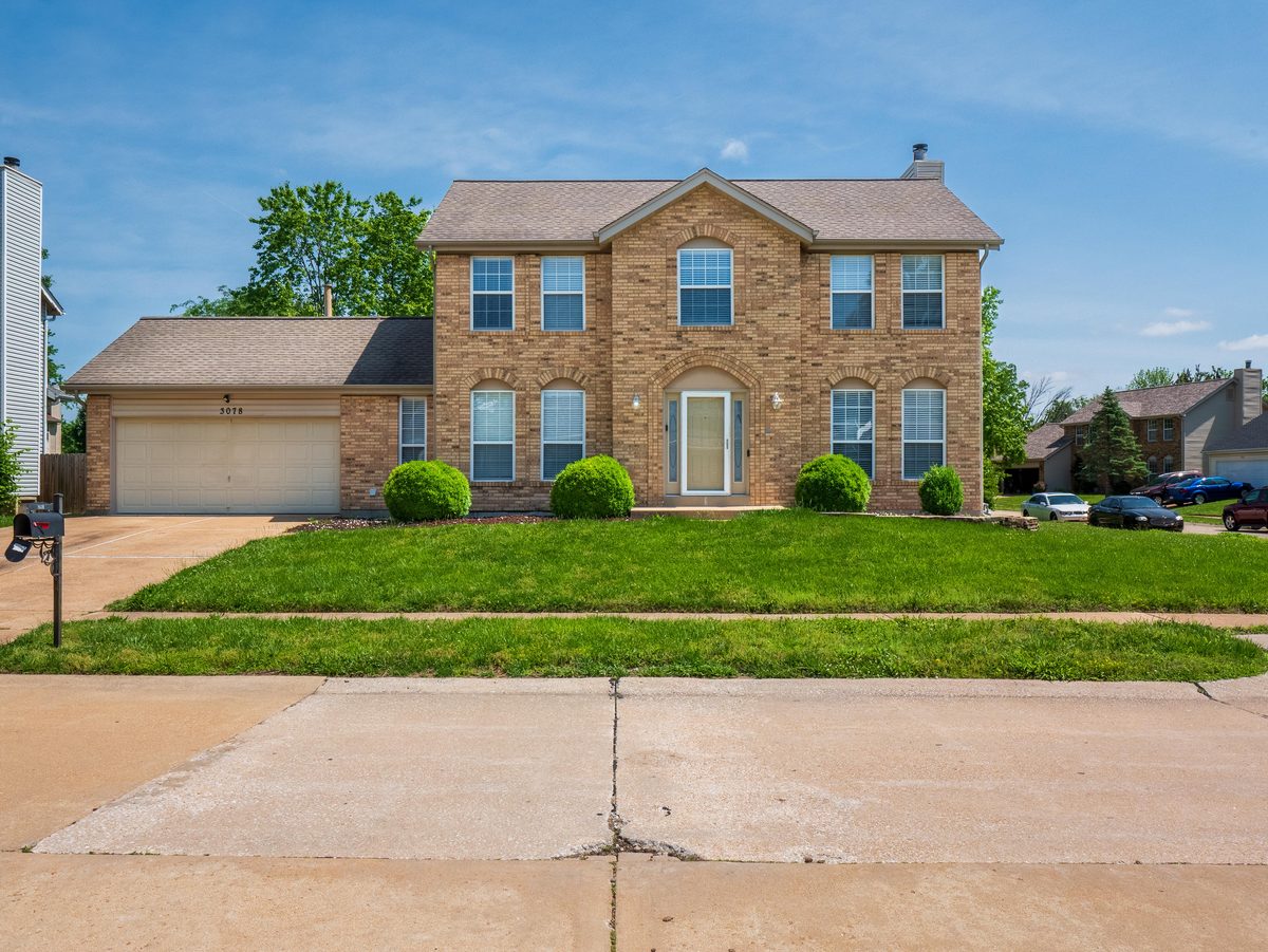 Two-story brick colonial with a two-car garage in Florissant, North County St. Louis